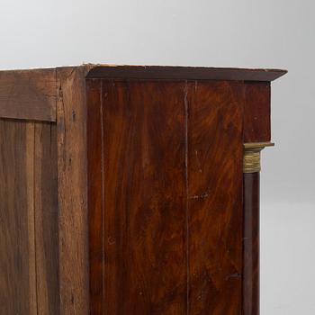A empire chiffonier. First half of the 19th century.