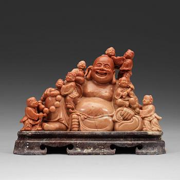 A soapstone group of Bodai with attendants, late Qing dynasty (1644-1912).