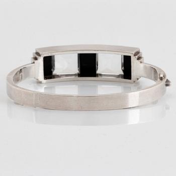 Wiwen Nilsson, a sterling silver bangle with facet cut rock crystal and onyx, Lund, Sweden 1940.