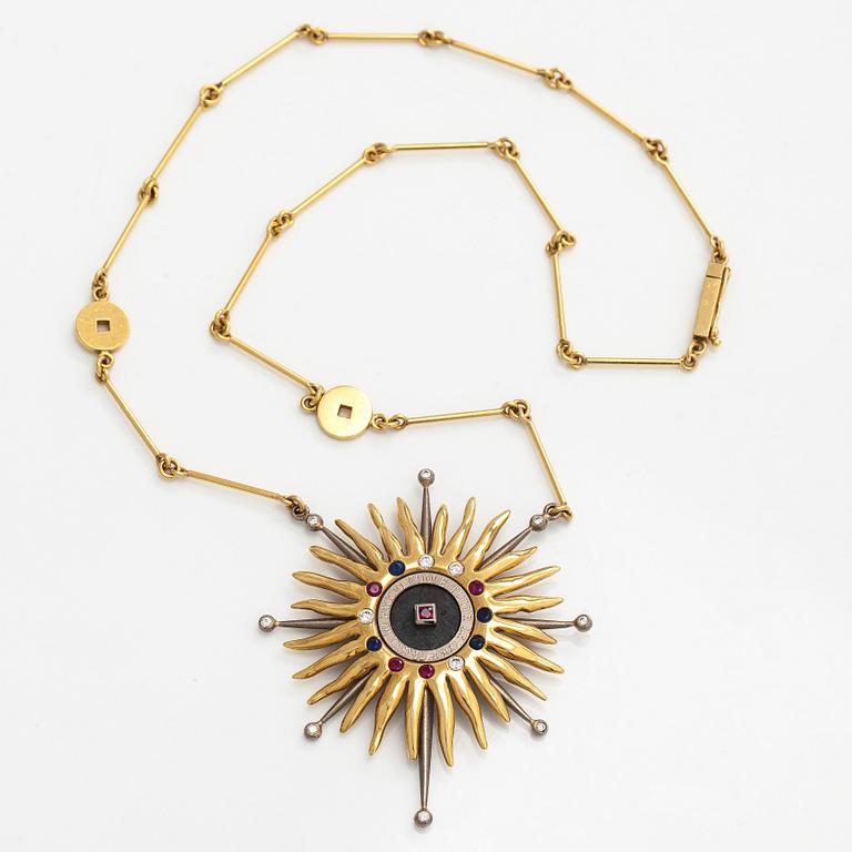 Pendant, faceted sapphires, rubies and diamonds, iron ore, 18K gold and white gold.