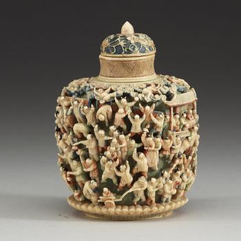 A deeply carved ivory snuff bottle with cover, China, early 20th Century.