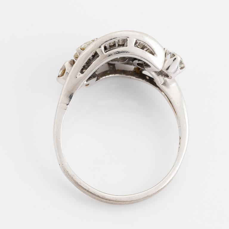 Platinum, brilliant and baguette cut diamond ring.