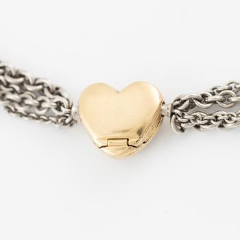 Necklace, Ole Lynggaard, with heart-shaped clasp in 18K gold set with brilliant-cut diamonds, chain in silver with four strands.