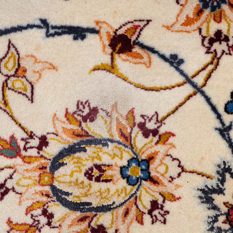 An Isfahan carpet, signed, approx. 372 x 255 cm.