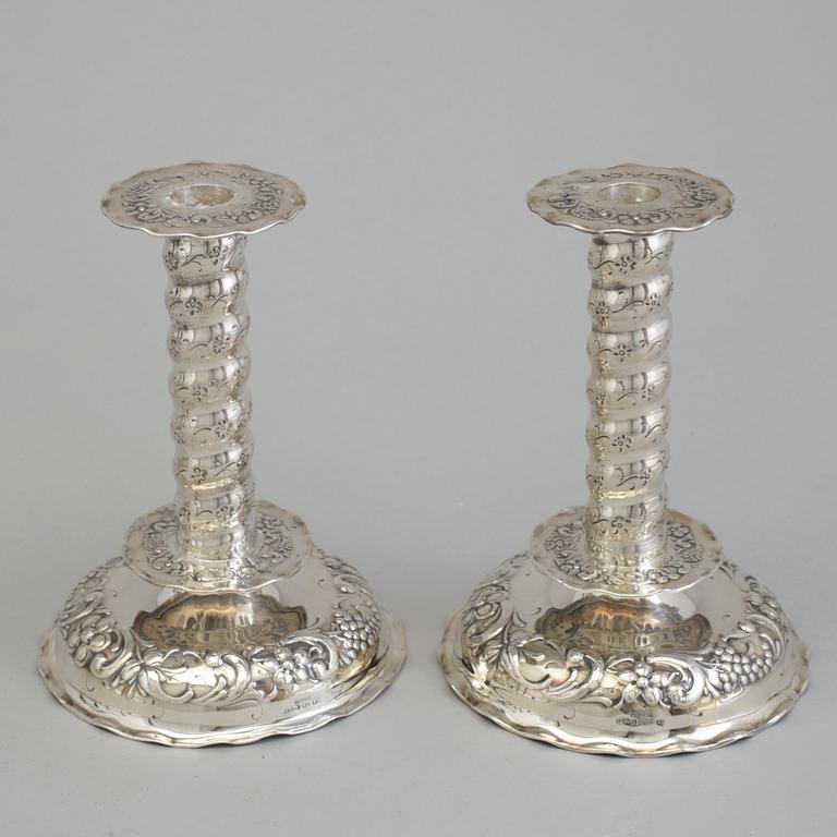 A pair of mid 20th century baroque style candle holders.