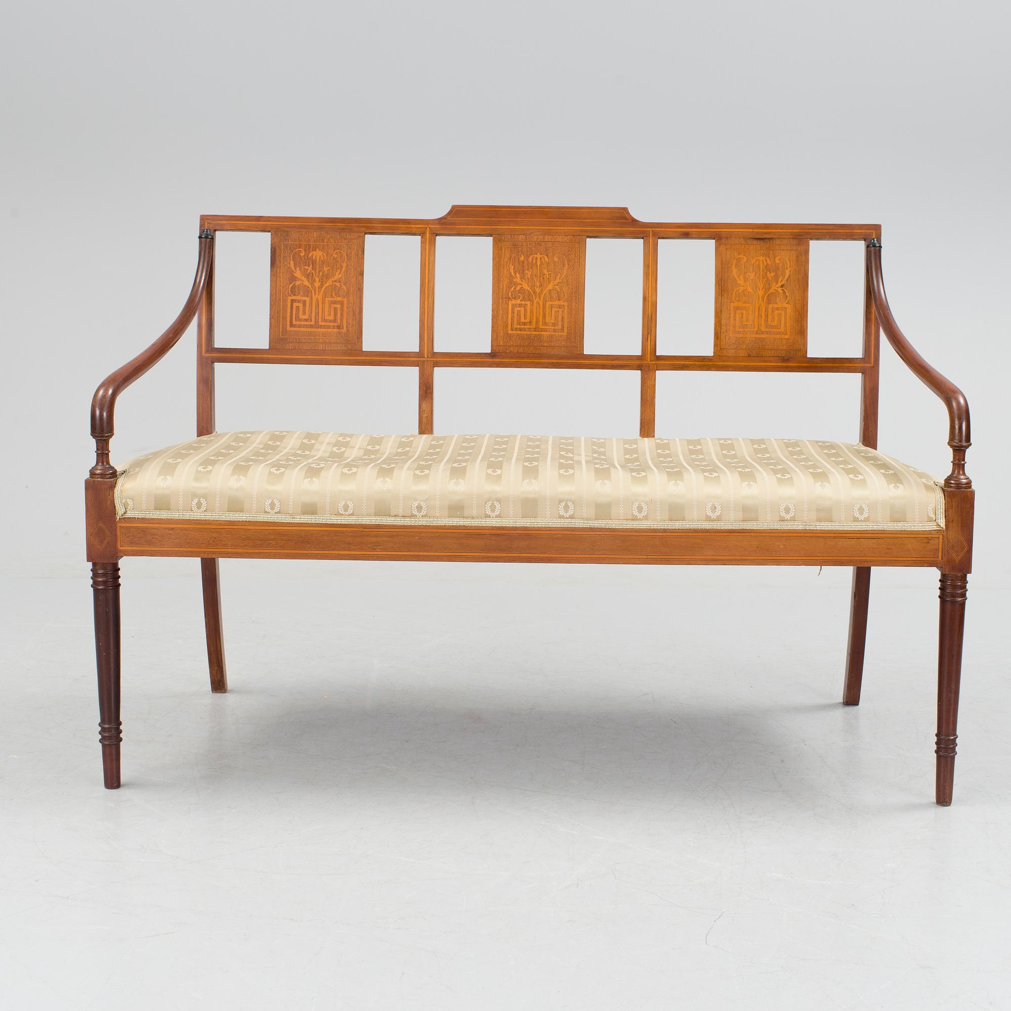 A 1920/30s Swedish Grace sofa, a pair of chairs, a pair of armchairs and a table veneered with mahogany.