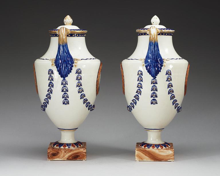 A pair of famille rose vases with covers, Qing dynasty, Qianlong (1736-95).