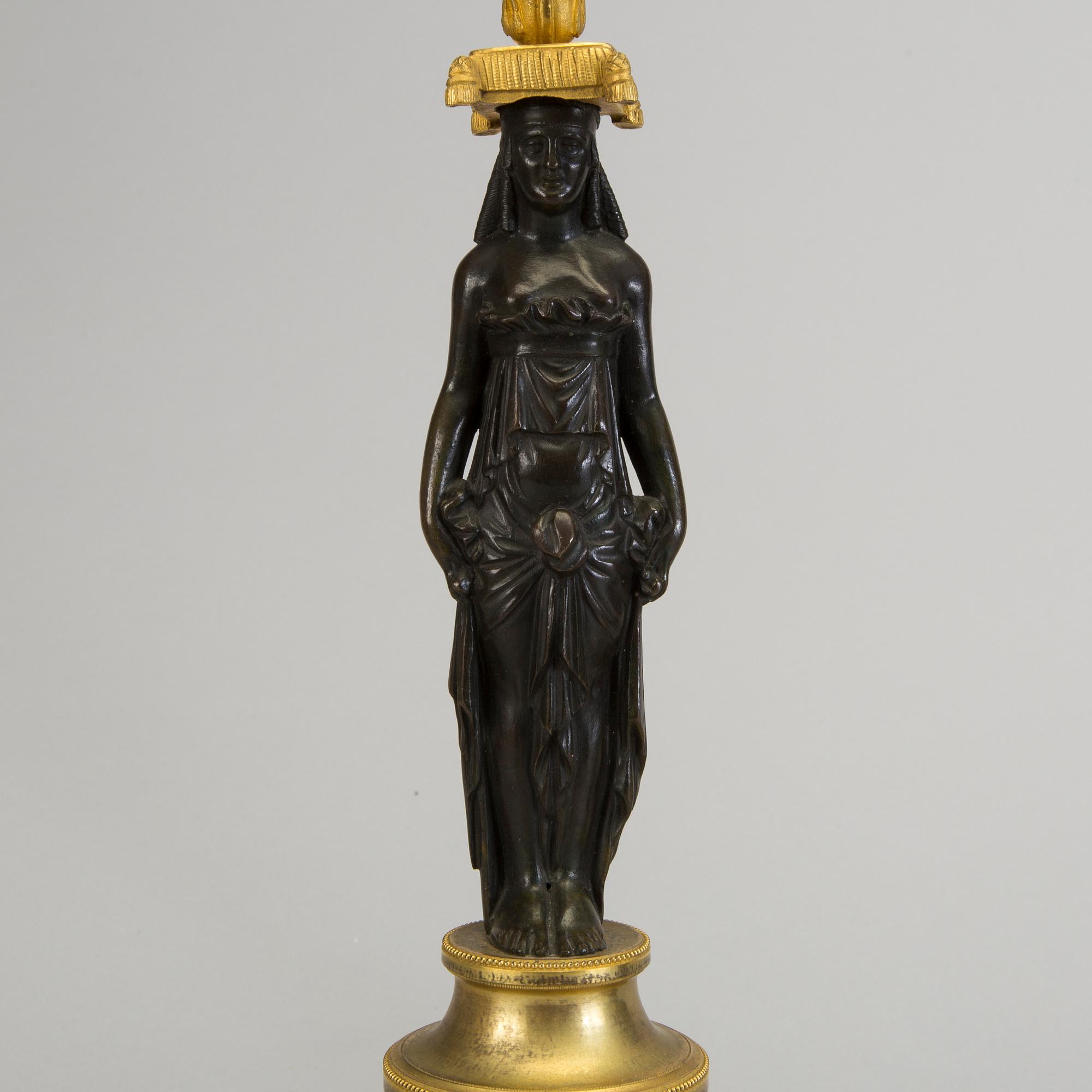 A pair of 1800s empire candelabras.