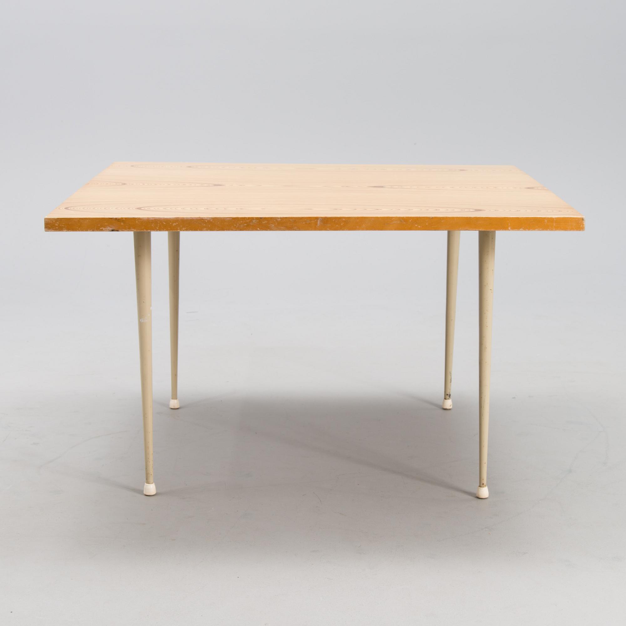 A coffee table marked Tapio Wirkkala, Asko, Made in Finland.