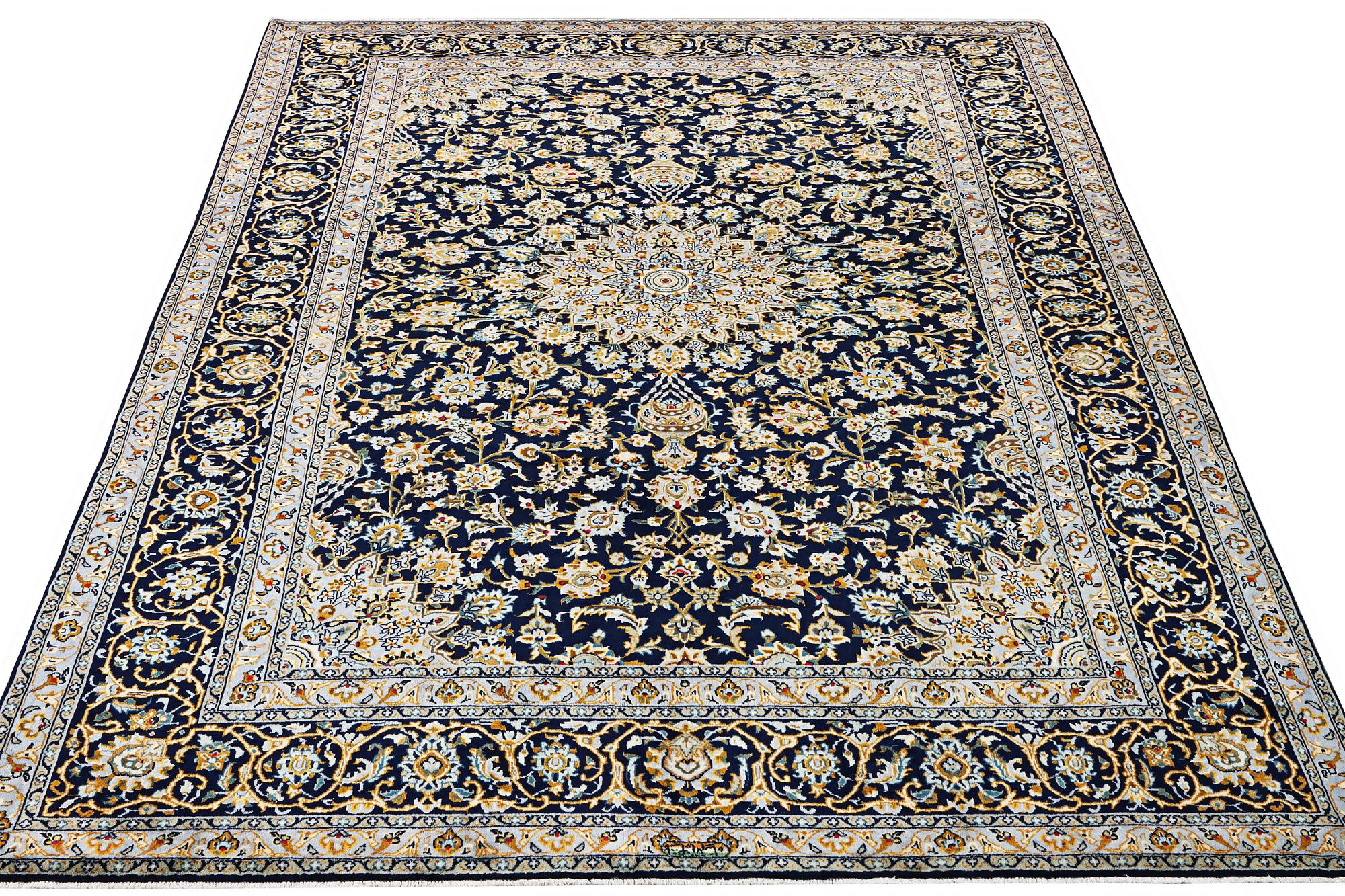 A Kashan carpet, c. 343 x 236 cm.