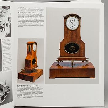 A set of 6 watch books.