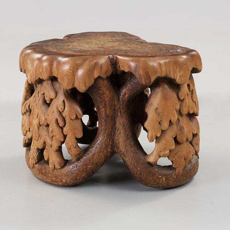 Knut Fjaestad, an Art Nouveau sculptured pine table/stool, Sweden ca 1900.