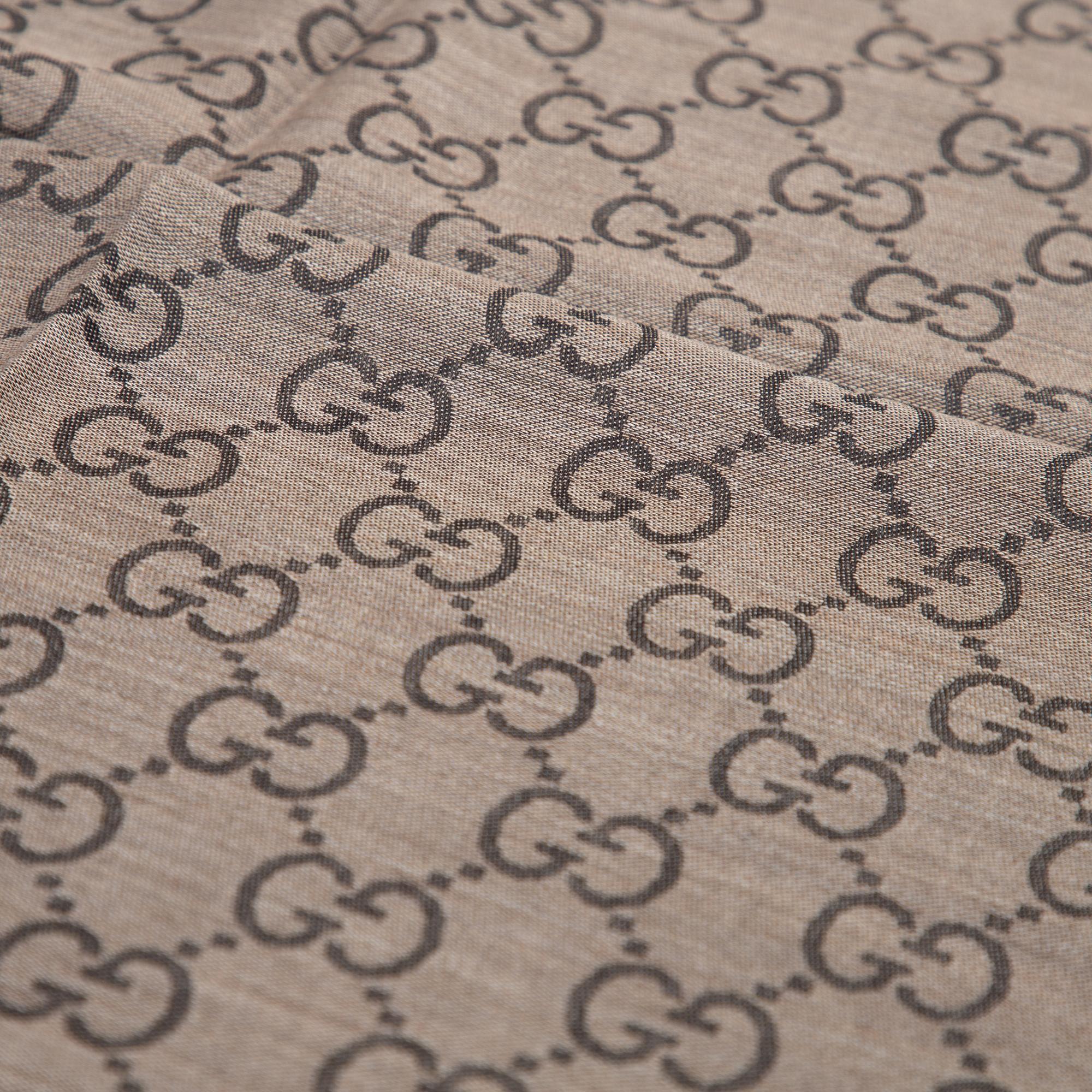 Gucci, a wool and silk mix 'GG' jaquard shawl.