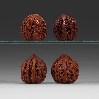 Two pairs of carved walnut hand exercisers, late Qing dynasty (1644-1912).