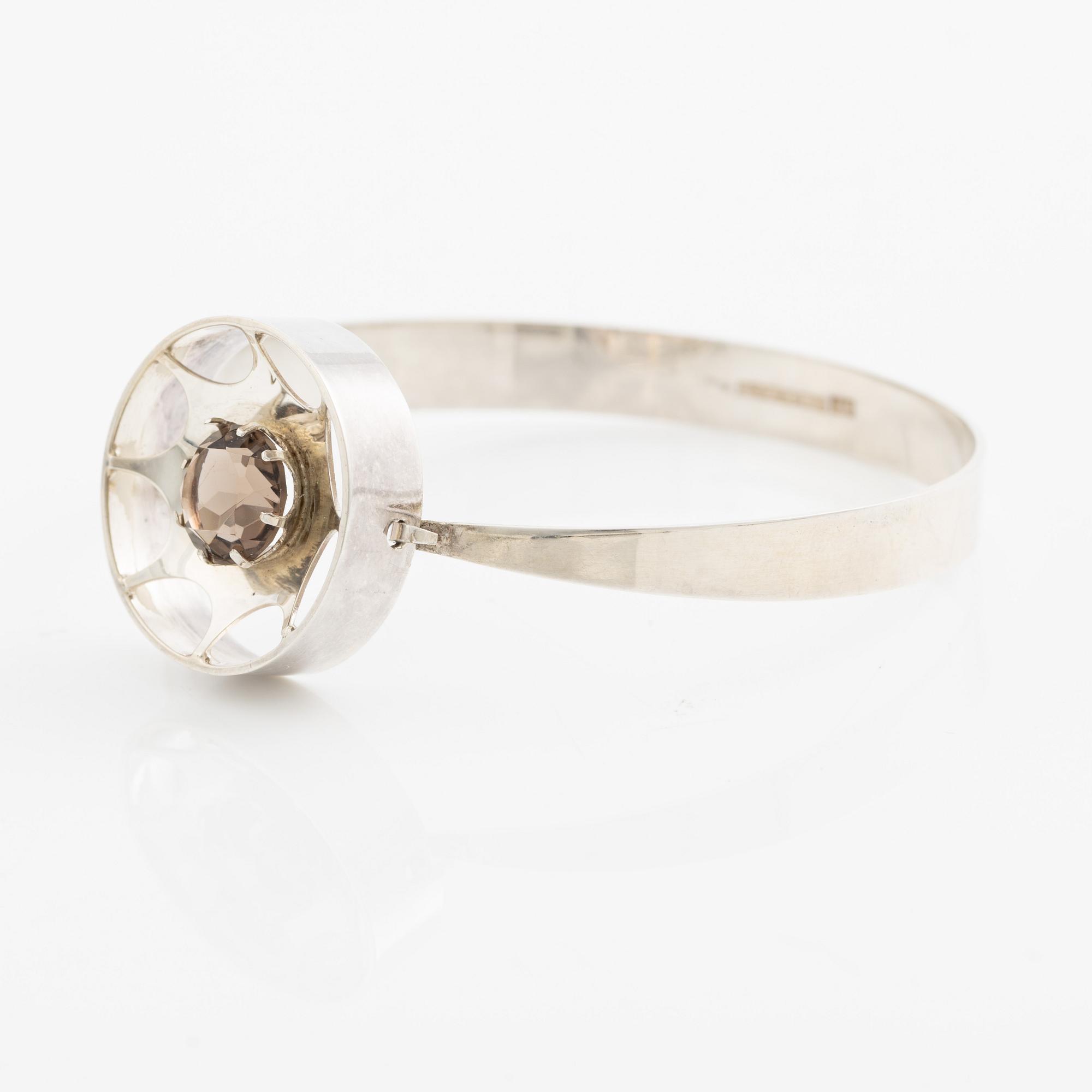 Arm ring and brooch, silver with smoky quartz, Kultasepät Salovaara.