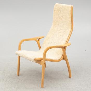 Yngve Ekström, a 'Lamino' armchair and ottoman, Swedese, 2002.