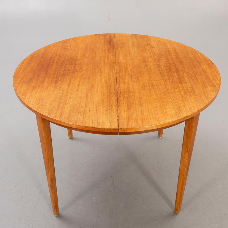 A 1960s teak dining table.