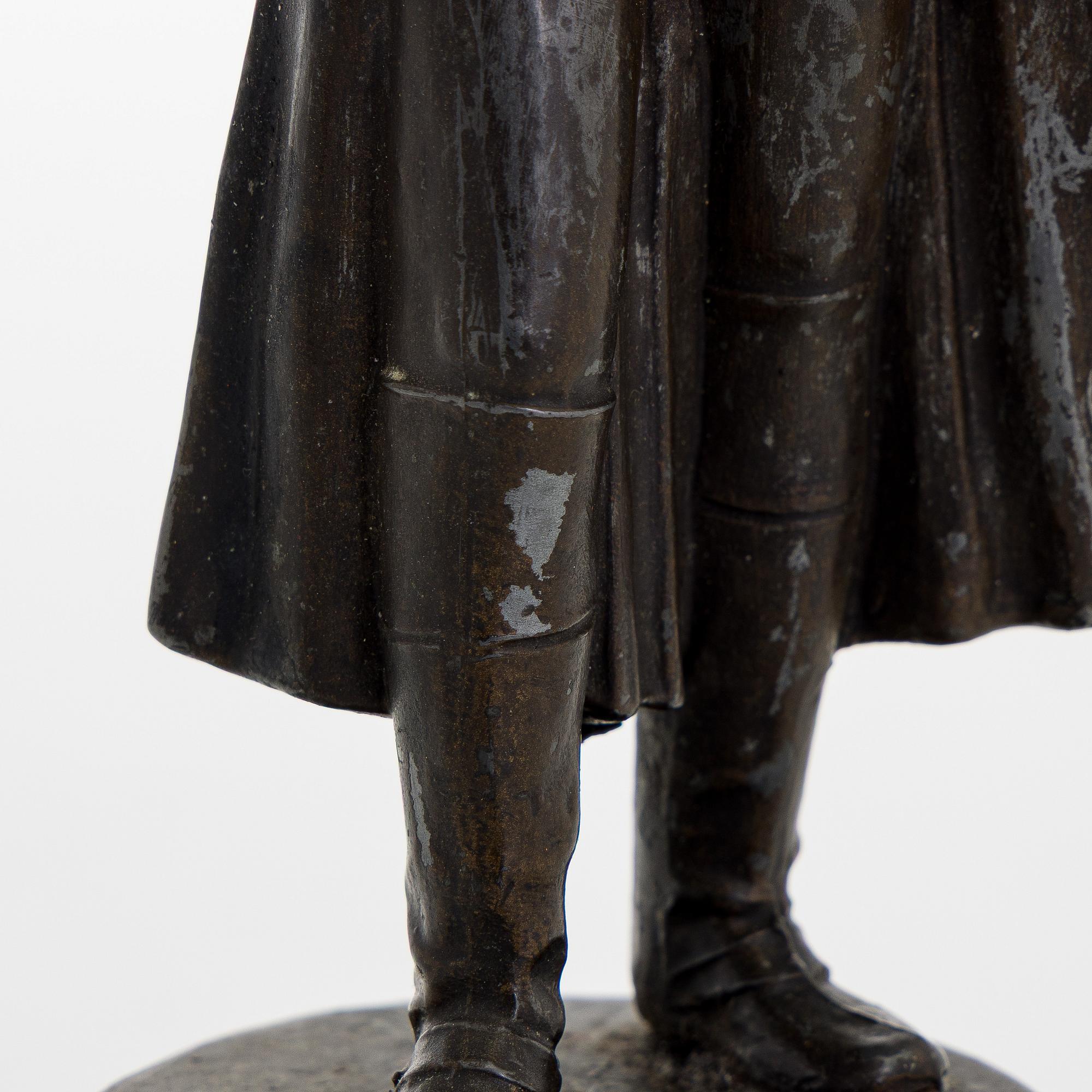 A 20th century patinated white metal sculpture.