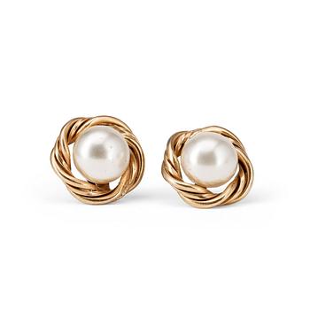 CHANEL, a pair of decorative pearl earrings.