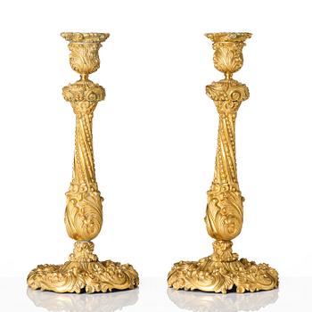 A pair of gilt-bronze rococo-revival candlesticks, later part 19th century.