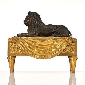 A pair of Louis XVI gilt and patinated bronze chenets.