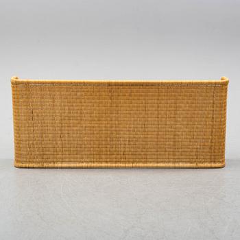 A late 20th century rattan bedside.