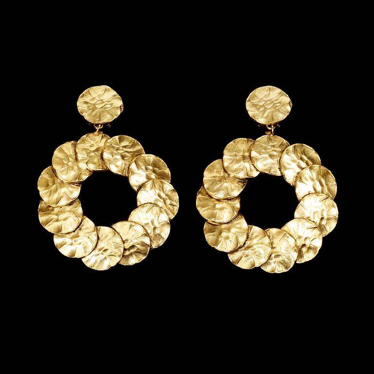 A pair of earrings by Yves Saint Laurent.