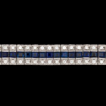 1088. A brilliant cut diamond, tot. app. 3.20 cts, and blue sapphire bracelet.