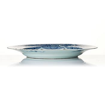 A massive blue and white 'peacock' charger, Qing dynasty, early 18th century.