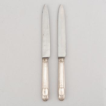 A set of twelve French silver knives, 19th century.