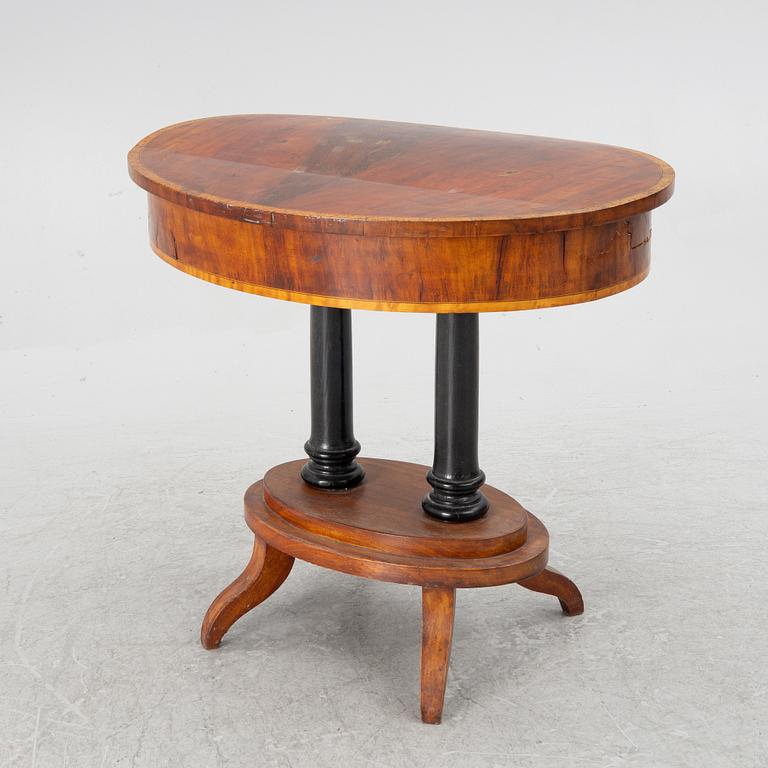 An Empire sewing table, mid-19th Century.