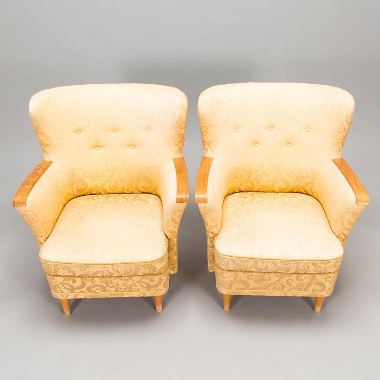 A pair of 1950's armchairs.