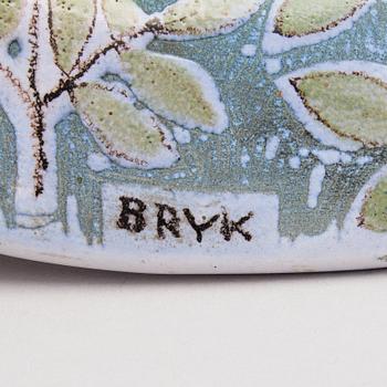 A ceramic plate signed Bryk Arabia.