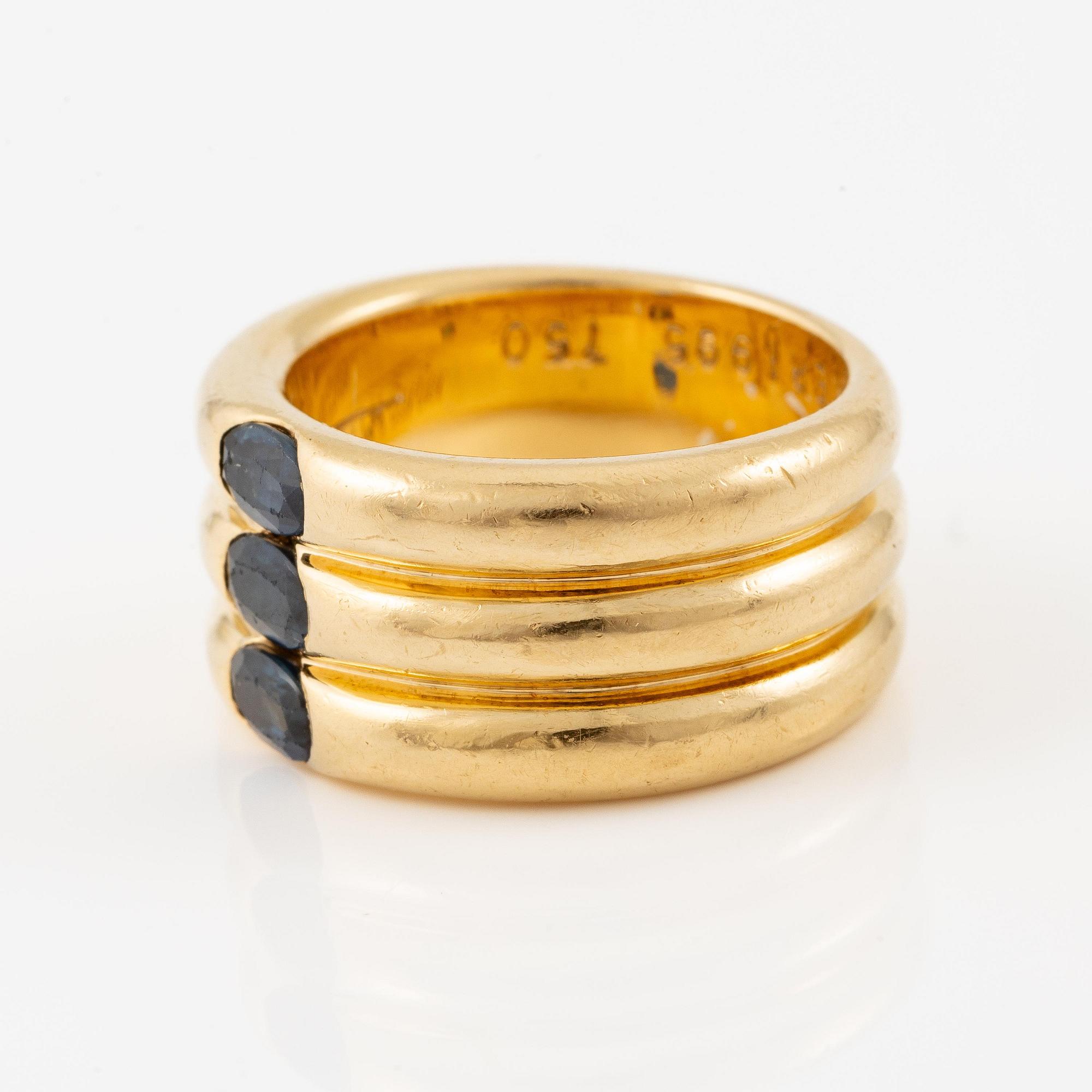 A Cartier ring "Ellipse" 18K gold with faceted sapphires.
