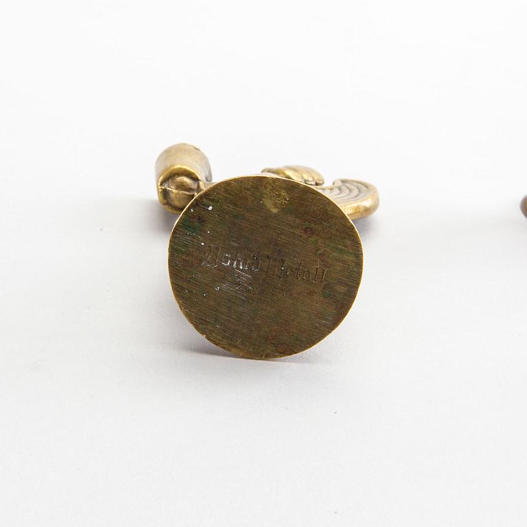 Four second half of the 20th century brass CANDLESTICKS.