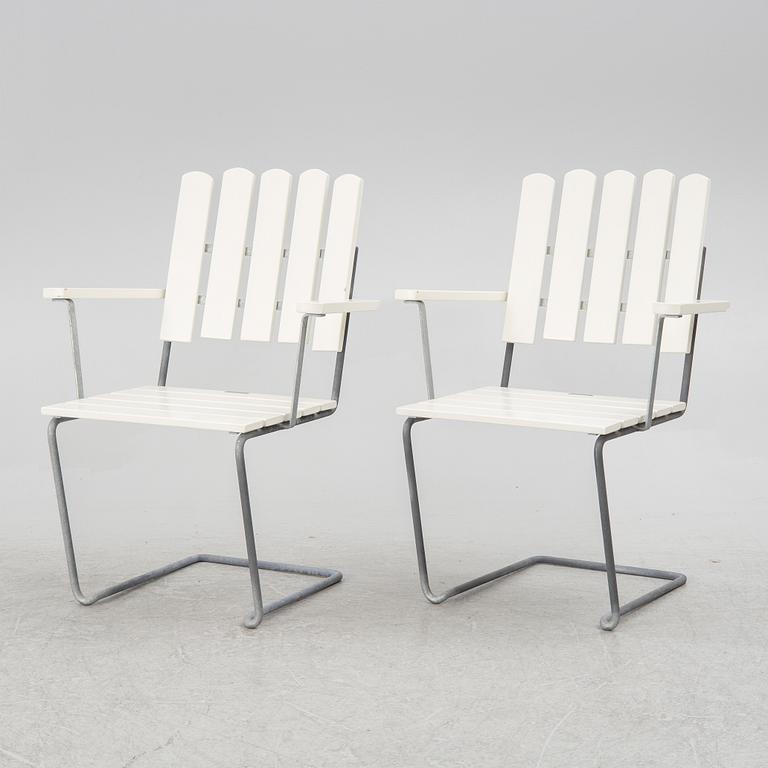 Arthur Lindquist, four armchairs model A2 and a table 9A, Grythyttan's steel furniture.