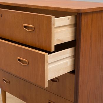 A second half of the 20th century teak veneered chest of four drawers.