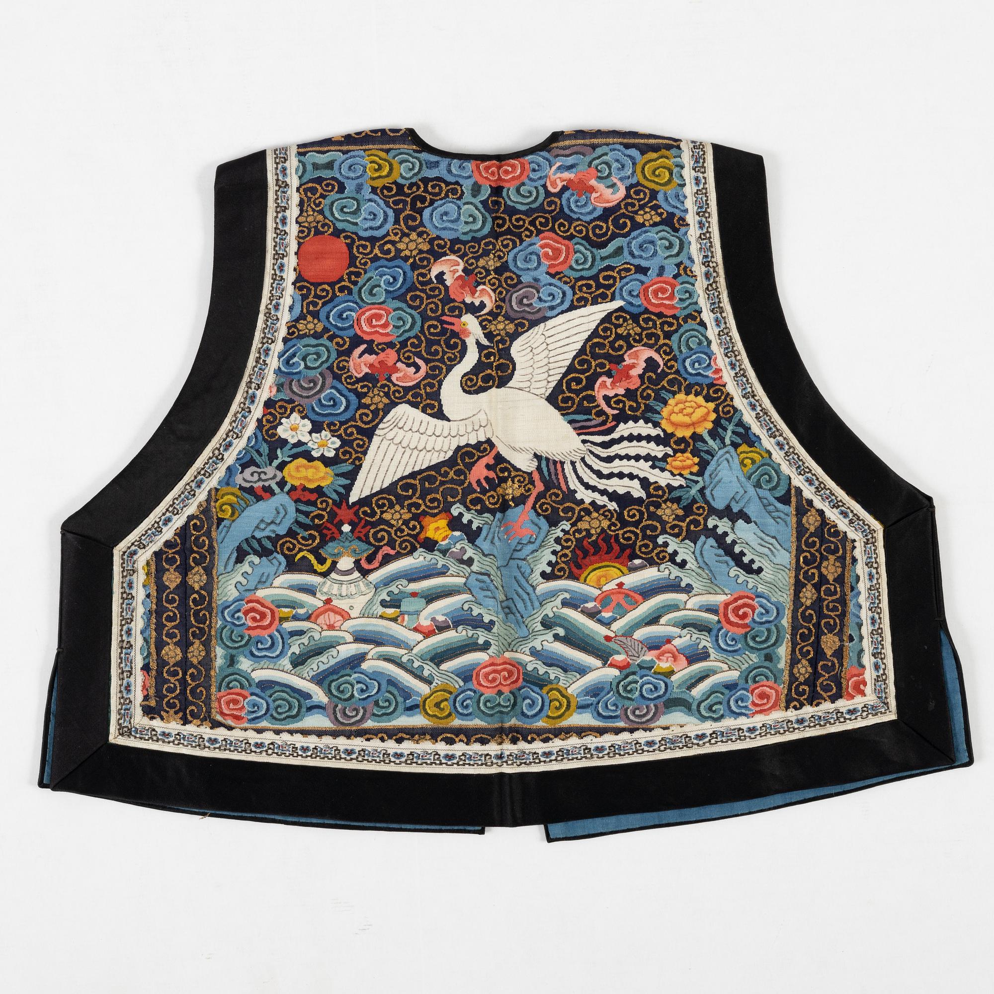 A collar a vest and two Chinese embroidered silk textiles, late Qing dynasty / early 20th century.