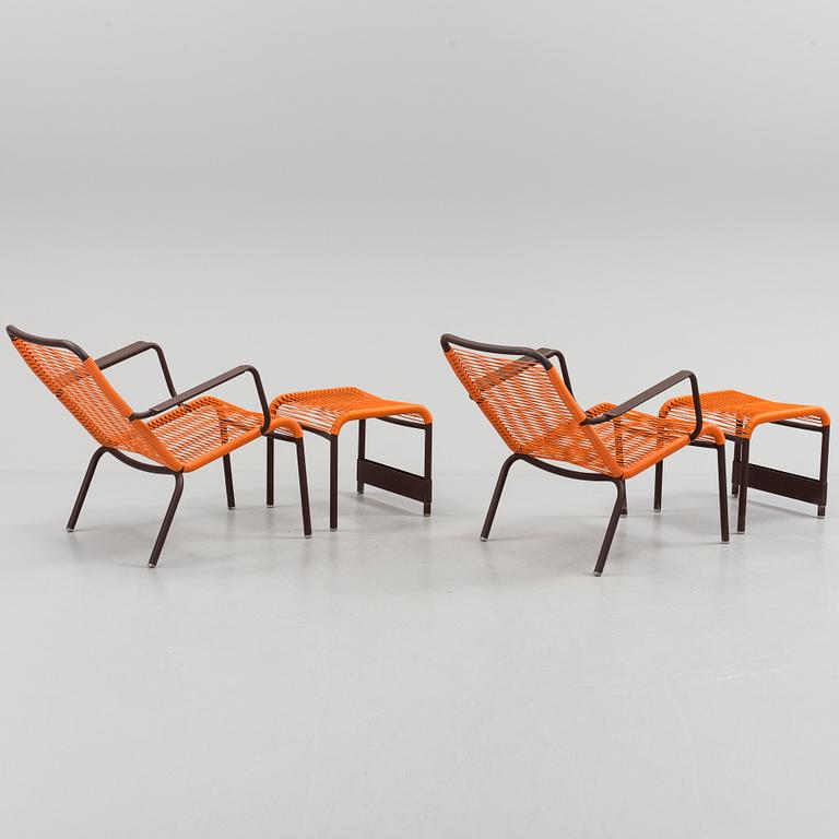 a pair of FRÉDÉRIC SOFIA "Saint Tropez" lounge chairs with footstools, by Fermob.