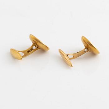 Ett par manschettknappar 18K guld med pärlemor.