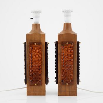 A pair of 1960's-/70's walnut and glass table lamps.