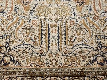 A silk Qum carpet, around  219 x 137 cm.