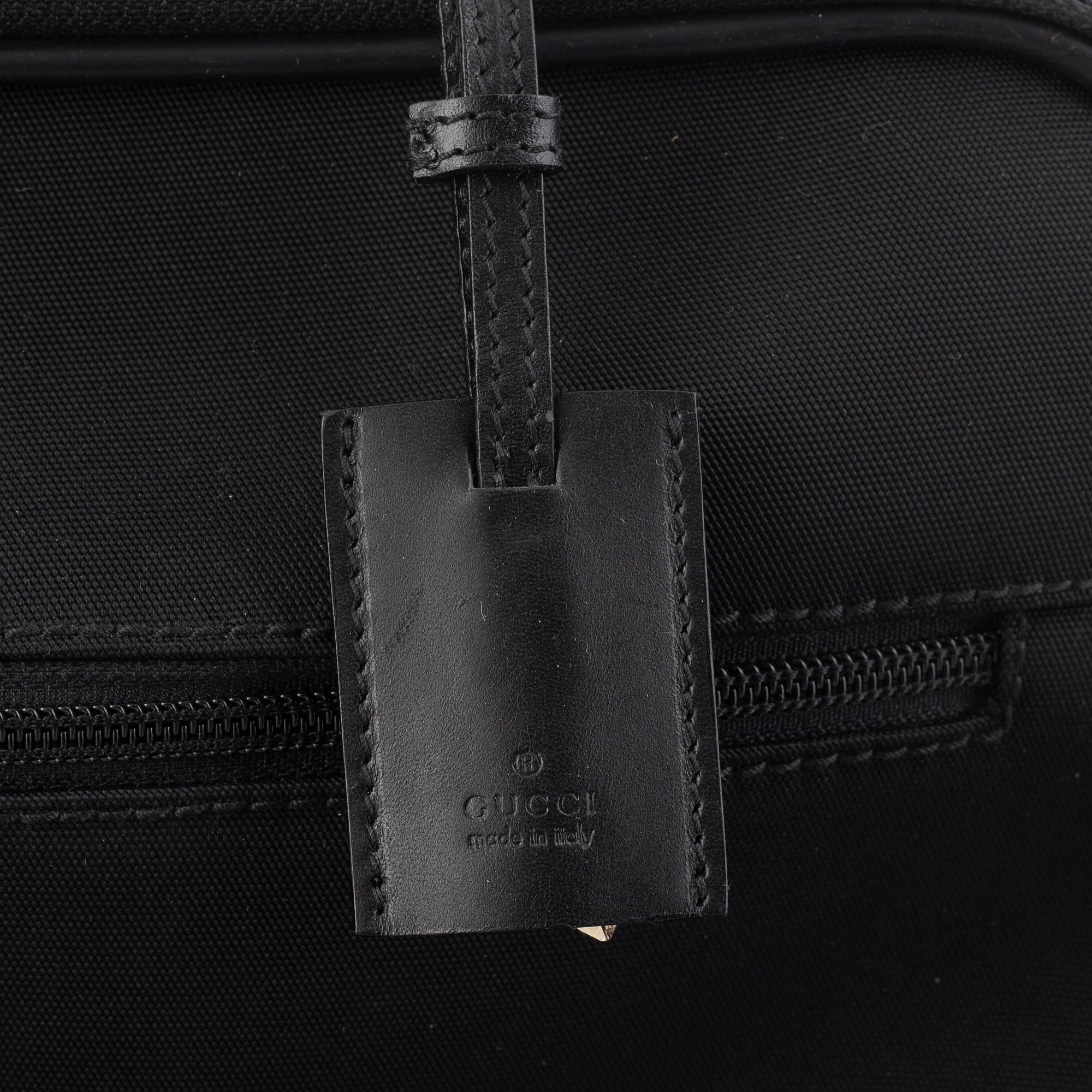 Gucci, suitcase/cabin bag.
