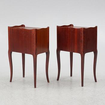 A pair of Rococo style bedside tables, second half of the 20th Century.