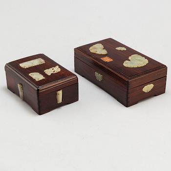 Two Chinese wooden boxes with covers, with nephrite objects, 20th century.