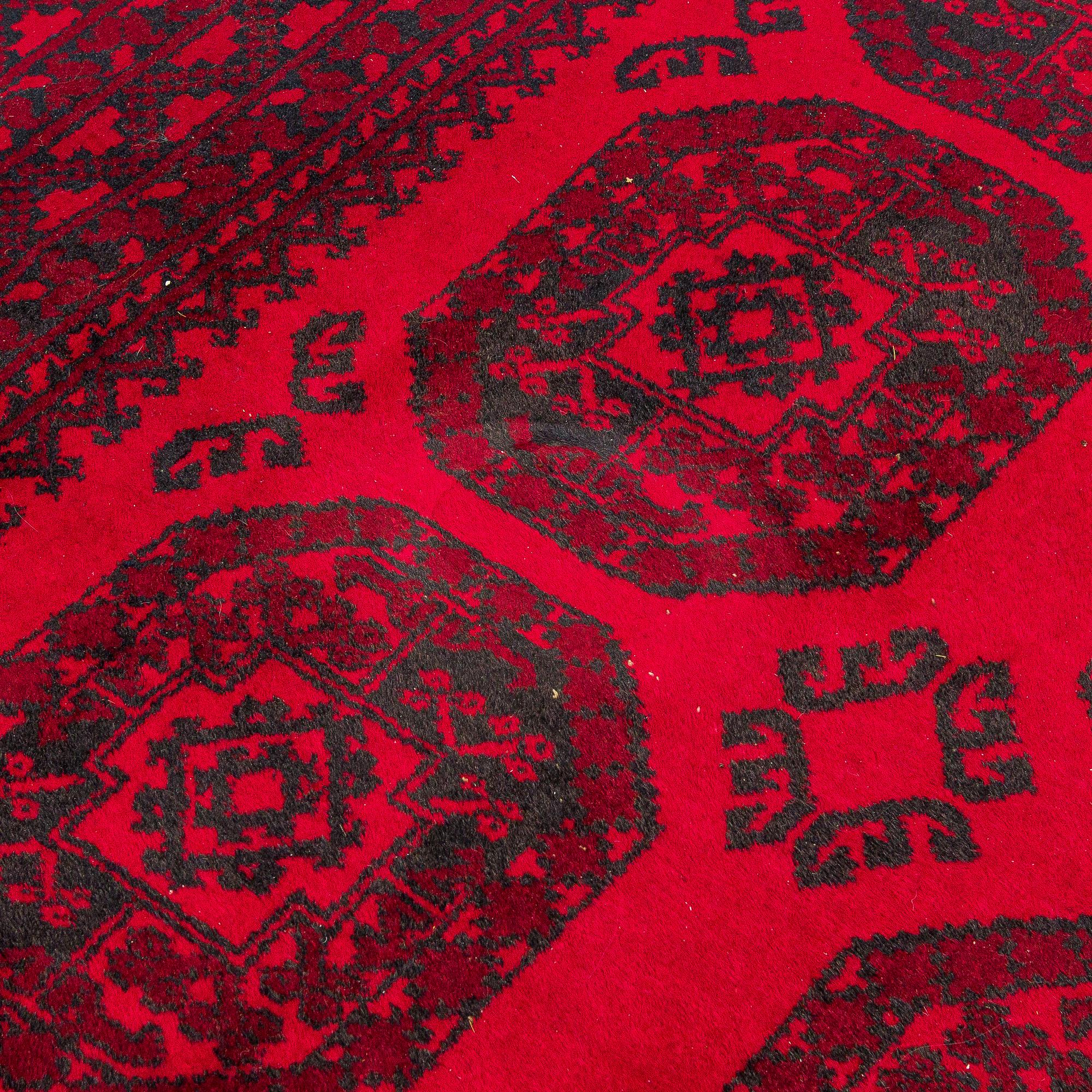 Two Afghan carpets. Ca. 326 x 217 and 88 x 63 cm.