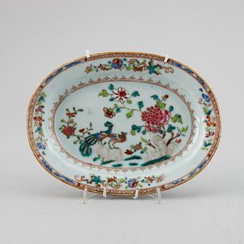 An oval famille rose doubel peacock dish for a butter tureen, Qing dynasty, Qianlong (1736-95).