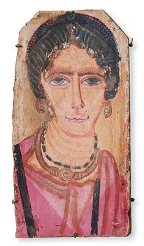 An Egyptian painted wooden part of a coffin, Roman period ca 121 -245 AD.