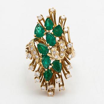 A 14K gold ring, with pear-cut emeralds and brilliant-cut diamonds totalling approximately 0.57 ct.
