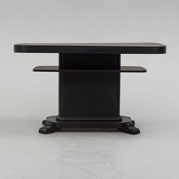 a coffee table from the first half of the 20th century.